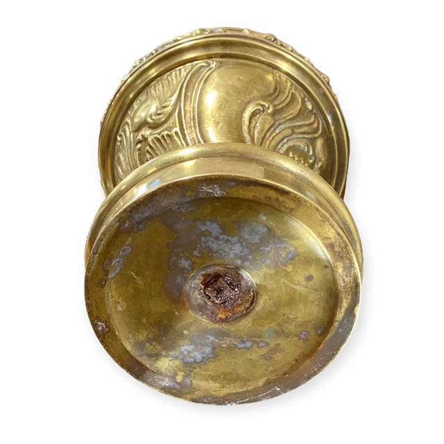 A stunning antique German oil lamp in gilded chased brass having very detailed designs throughout.