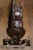Late 19th, early 20th century folk art wrought iron andirons. These are in the form of chain mouthed griffins having cross...