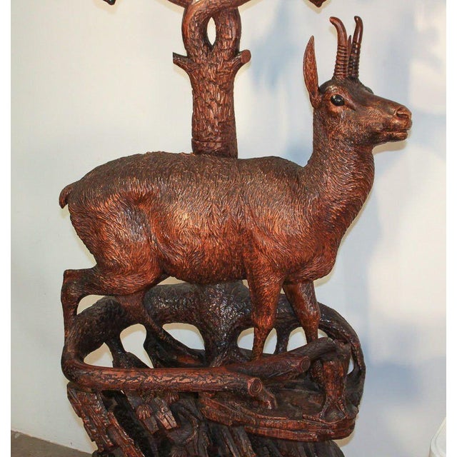 Magnificent rare Swiss Black Forest carved deer form hall stand with mirror. Having impeccably detailed deer and eagle...