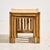 A nesting table from the 1970s made of natural materials. The table consists of three pieces with a bamboo frame and...