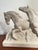 This elegant French Art Deco sculpture features two stylized horses galloping side-by-side on a rectangular base. The...