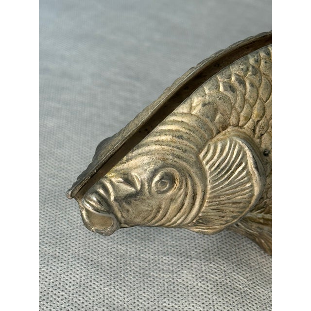 Vintage cast-metal napkin holder shaped as a detailed fish — solid, decorative, and characteristic of Italian...