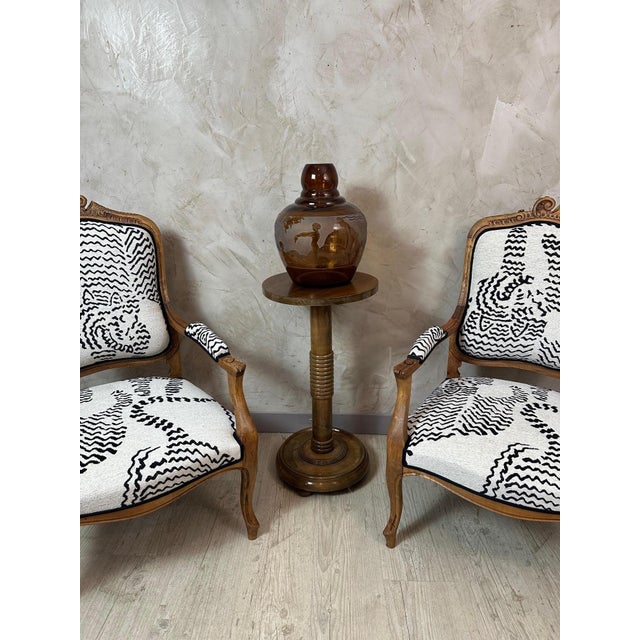 A beautiful walnut side table, dating from the 1940s, crafted in the style of Charles Dudouyt, an iconic figure in French...