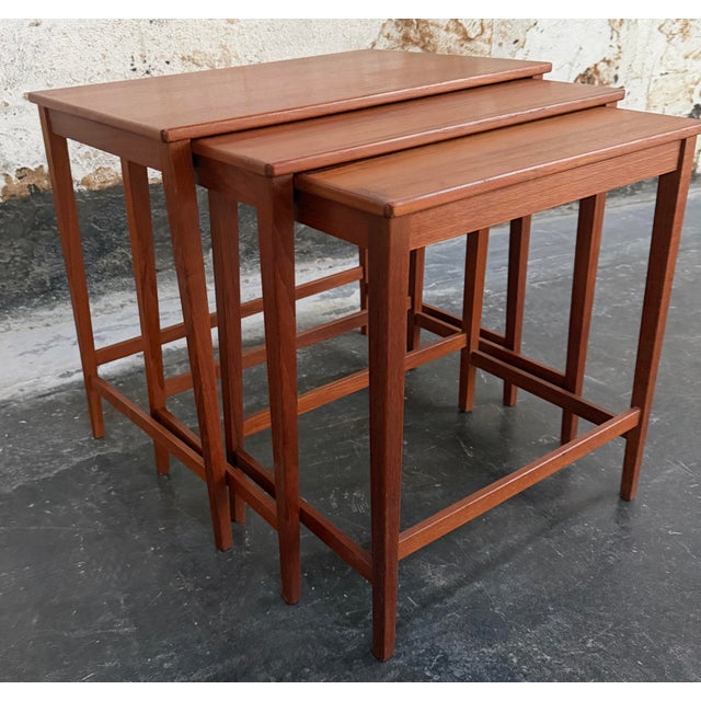 Exceptionally crafted sturdy set of three Mid-Century Swedish Modern nesting or stacking tables showcasing the functional...