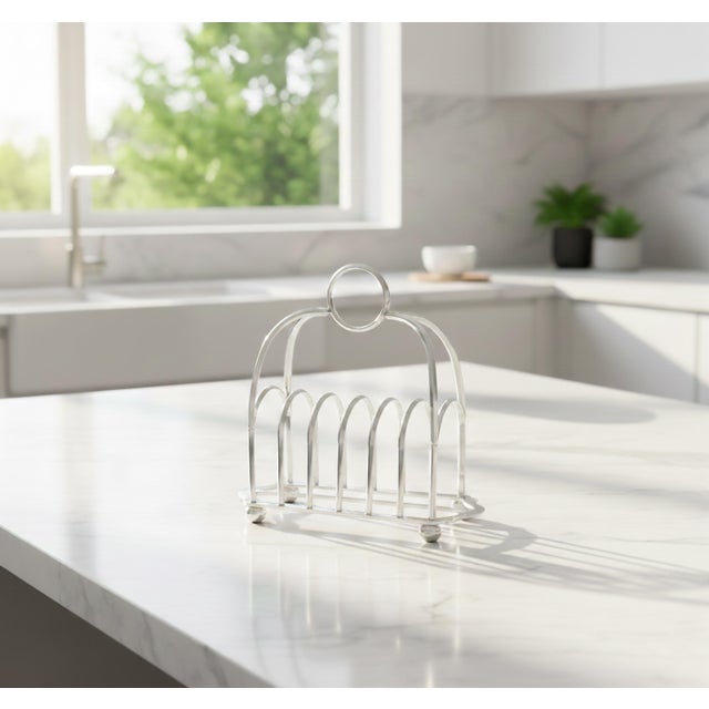 A stylish antique early 20th Century English silver plate six slice toast rack. Hallmarks on reverse. This fine toast rack...