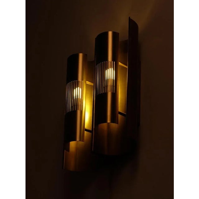 Custom made by Böhlmarks, Sweden, 1959. Solid brass. Set of 6 available. Measure: Height 40 cm. This piece is attributed...