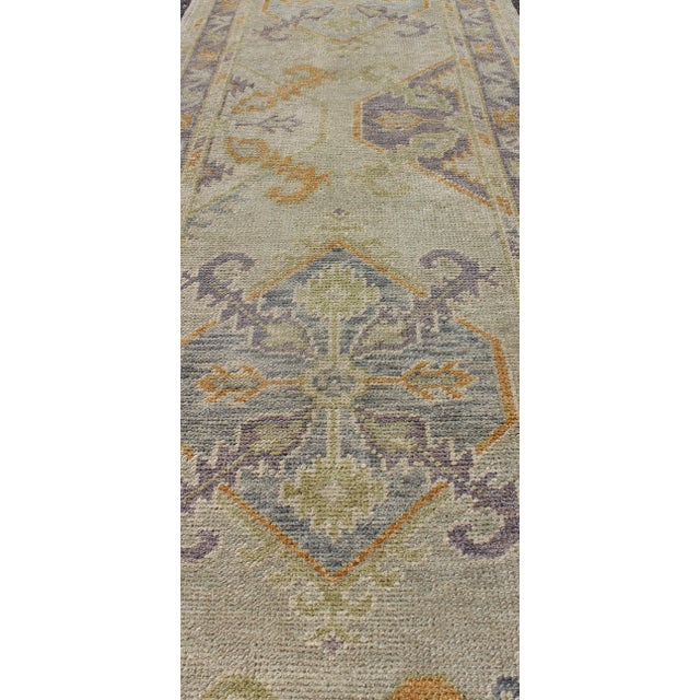 Turkish Oushak Runner With a Tribal Design in Purple, Blue and L.Green Colors by Keivan Woven Arts For Sale - Image 4 of 8