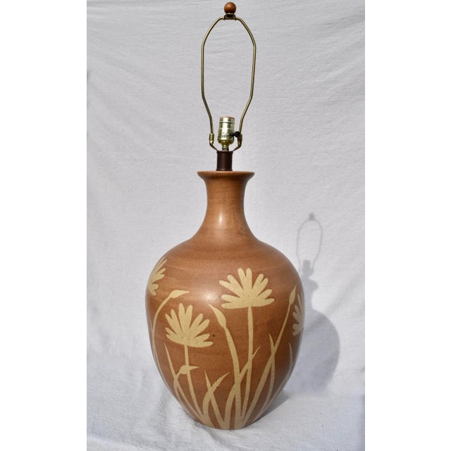 An impressive large pottery table lamp by Alvino Bagni for Raymor featuring floral motif with brass stem & original wiring...