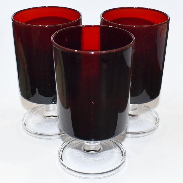 A set of French 3 ruby red cordial glasses by Luminarc. Marked at the bottom is "France". A great way to add color to any...