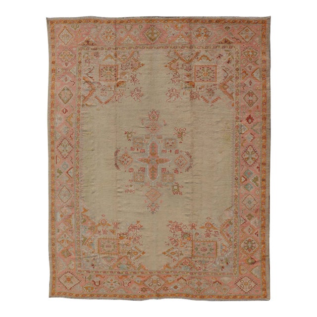 Antique Oushak Carpet With Medallion on a Pale Green Field With Vivid Border 9'11"x13'5" For Sale