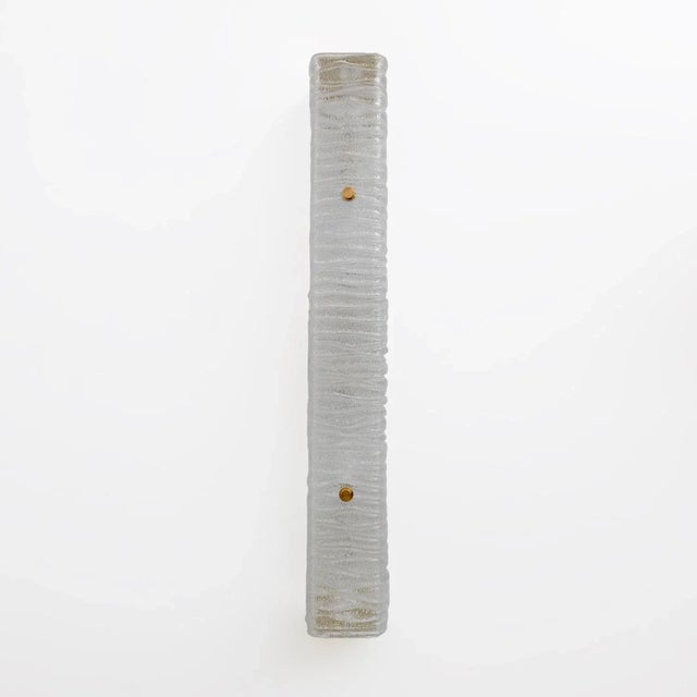 Pair of wall or ceiling lamps, in textured crystal Murano glass, bark effect with brass finishes. The lamps each have four...