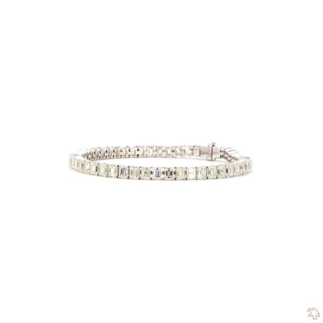 This estate bracelet from our contemporary estate collection centers on a 16.12-carat diamond in a step-cut emerald shape....