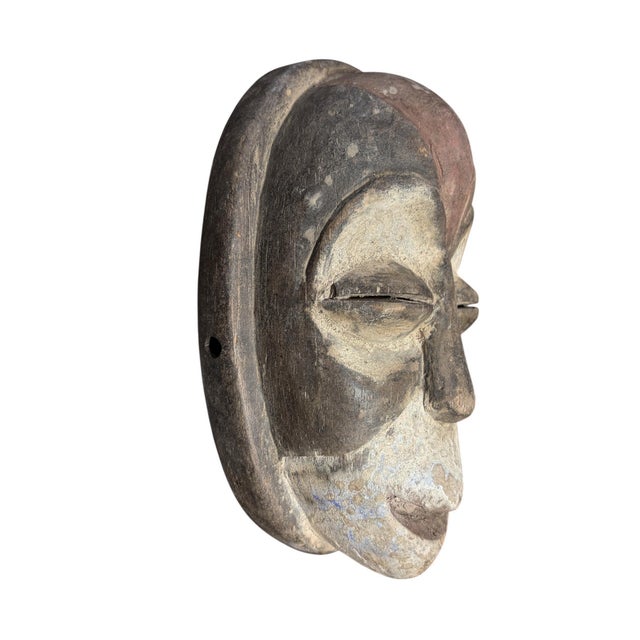 Vintage wooden tribal passport mask from Gabon, carved in the traditional Galoa tribe style. This ethnographic piece...