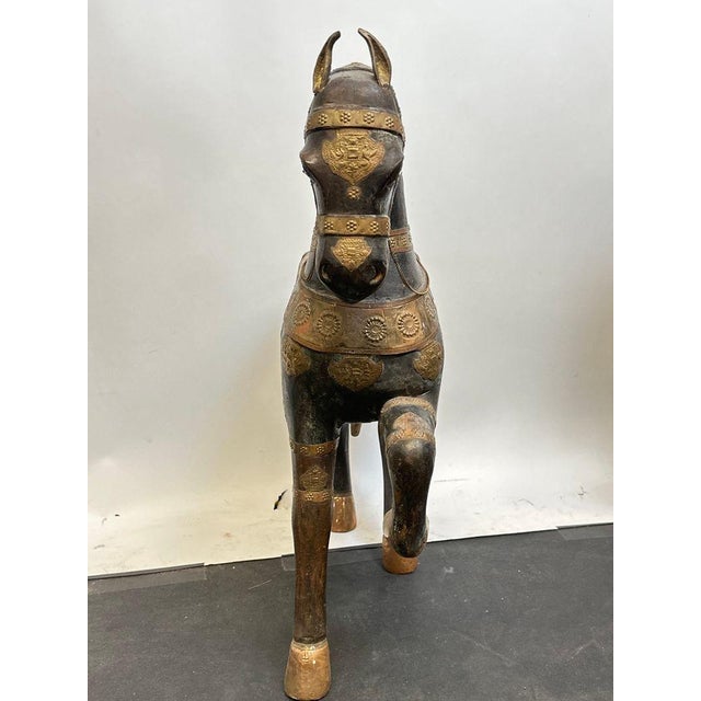 Stunning pair of antique hand-carved Marwari war horse sculptures from India. Each stands approximately 26.25 inches tall,...