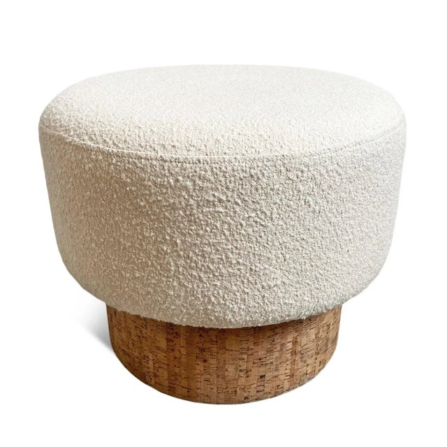 Contemporary round cork shape stool with cream boucle upholstery atop an acacia wood base. Chic and cozy, great used as a...