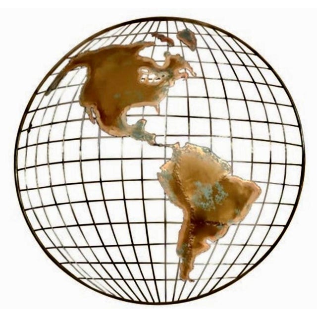 Majestic and iconic, Curtis Jere, brutalist, torch-cut, brass, double hemisphere, wall sculpture of the world The...