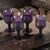 This vintage set of four amethyst purple glass wine glasses exudes a mid-century modern style and is perfect for all...