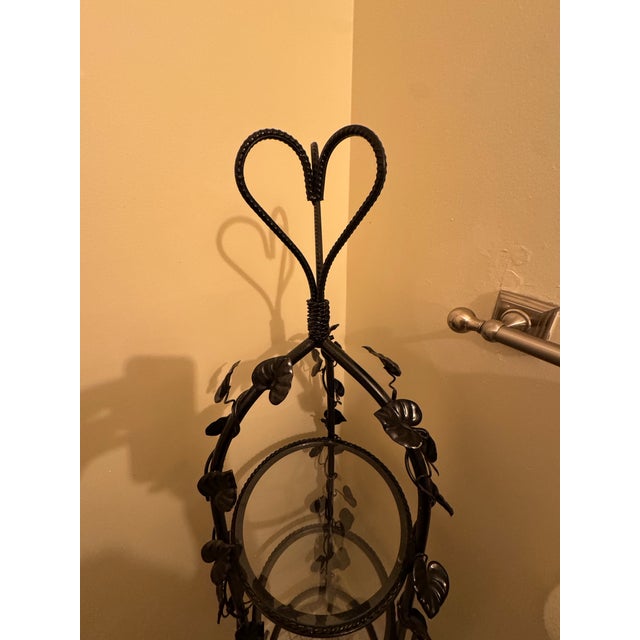 This elegant Vintage Wrought Iron 3-Tier Stand features a timeless Hollywood Regency aesthetic with an intricate Ivy and...