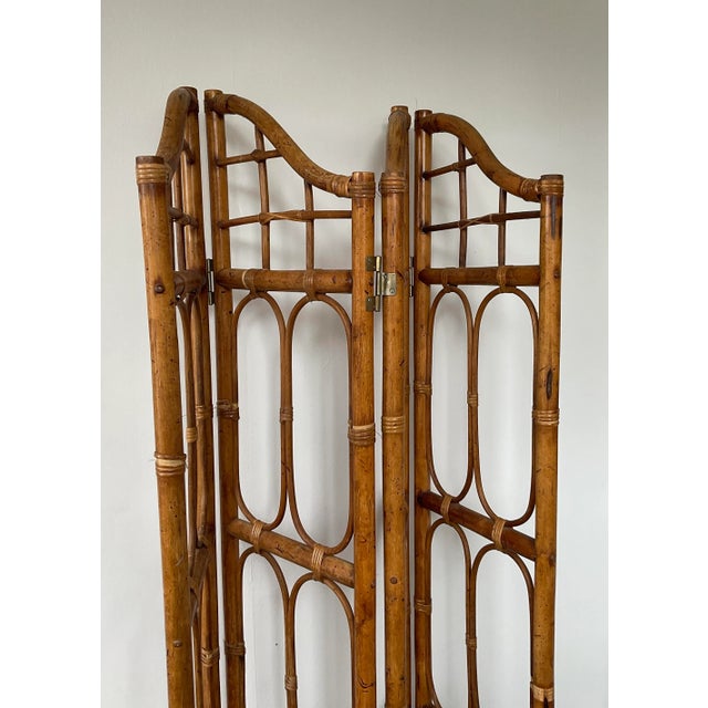 A wonderful bamboo room divider with arched tops. Due to hinging, screen opens up to 56” (doesn’t open fully flat)....