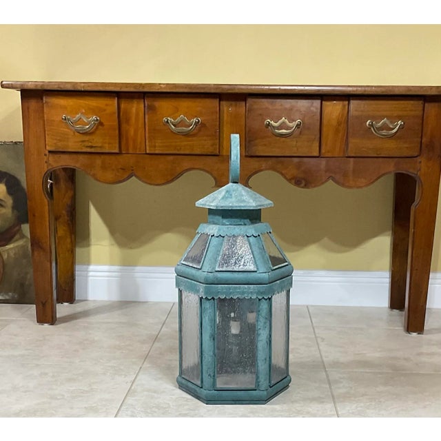 Funky vintage wall lantern handcrafted from solid brass, seeded glass, and three 40/watt lights suitable for wet location....