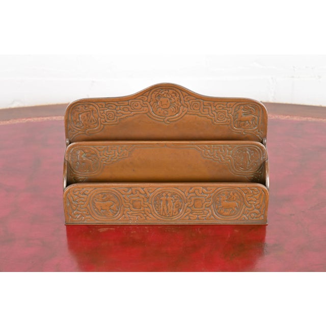 A gorgeous antique bronze desk letter rack featuring Zodiac designs By Tiffany Studios (signed to the underside) New York,...