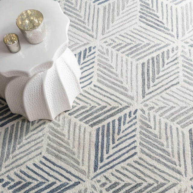 This art worthy floor covering explores all the shades of grey. With a radiant design of intersecting chevrons that, like...