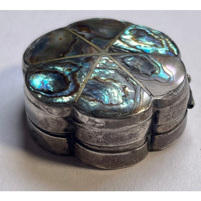 Handmade in Mexico, this is a sweet little hinged sterling silver and abalone pillbox. Stamped with 925 and the maker’s...