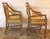 Late 20th century pair of McGuire "Target" back arm chairs, San Francisco. Stylish design with the distinctive, ever...