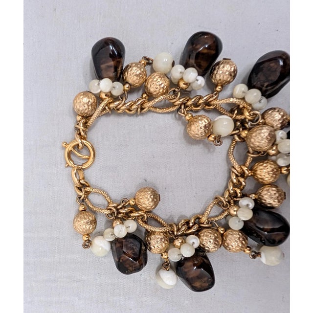 1960s Vintage 1960s Signed Napier Goldtone Faux-Topaz & Mother of Pearl Charm Bracelet For Sale - Image 5 of 14