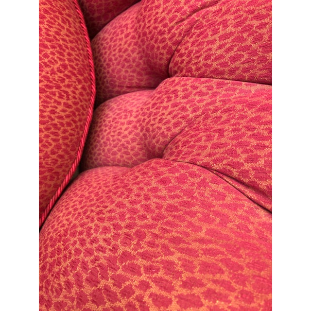 Very comfortable lounge chair reupholstered in designer woven fabric with bullion fringe on skirt, on ball casters. Down...