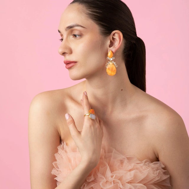 The Holly Earrings, crafted from semi-precious stones, showcase a unique shape and offer a removable drop, allowing for a...