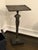 A dramatic Giacometti‑style sculptural side table by Global Views, blending functional furniture with expressive modern...