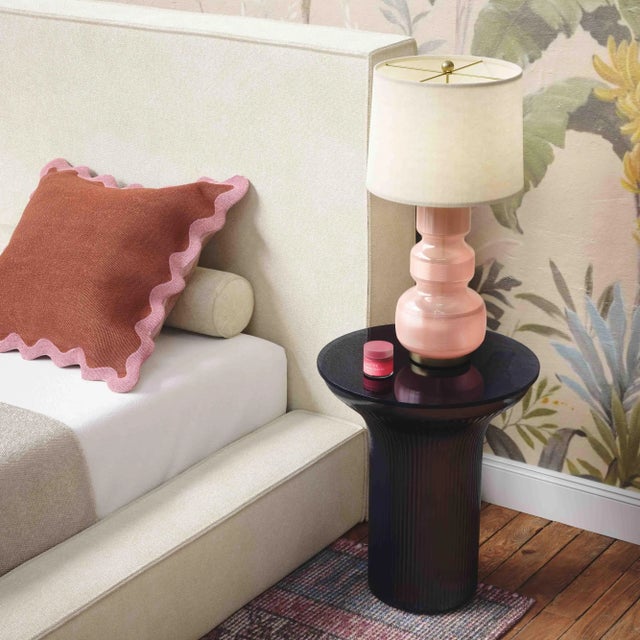 Introducing the Cassandra Glass Flared Side Table, a captivating blend of nostalgia and modern design, available in...