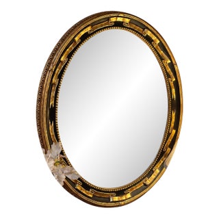 Vintage Federal Revival Black and Gold Parcel-Gilt Oval Wall Mirror For Sale