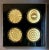 Here is a fantastic, vintage art piece that features 4 gold, circular holographic pieces set into a black, custom...