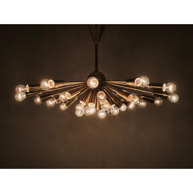 Exceptional large-scale 28-light sputnik chandelier manufactured by kamenický šenov in czechoslovakia during the 1970s....