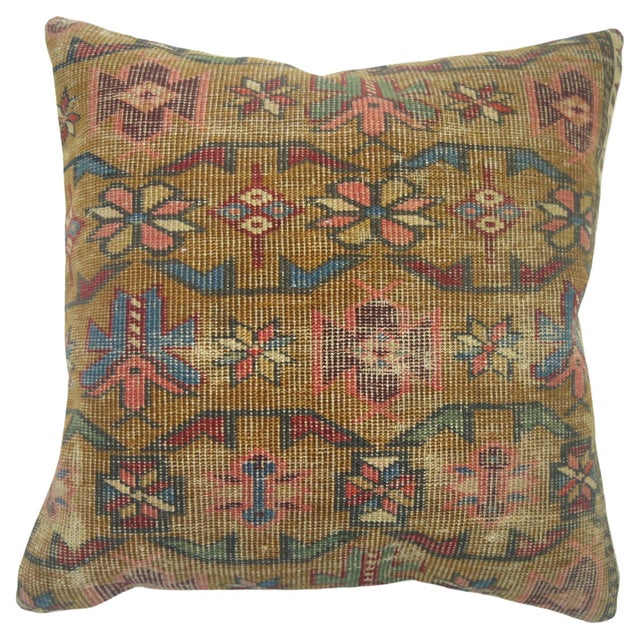 Pillow made from an antique 19th century Caucasian rug with cotton back. Zipper closure. Age wear. Measures: 15'' x 16''.