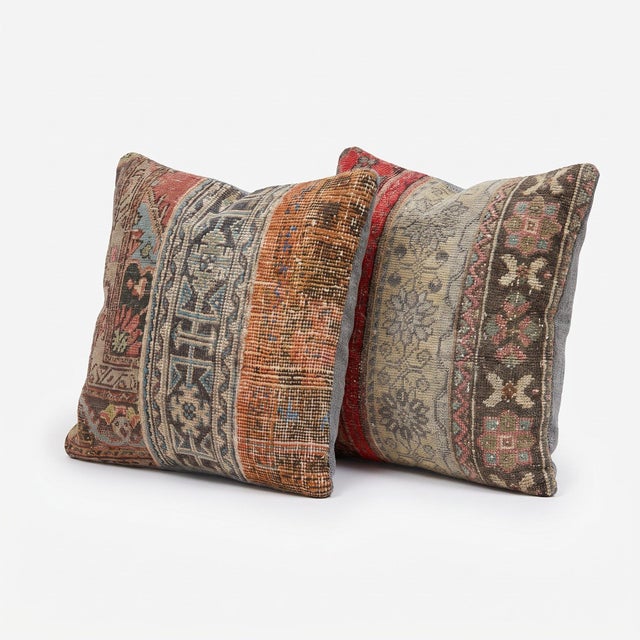 This 24'' x 24'' pillow cover set was made from authentic Turkish rug pieces — brick red and rust stripes with gray floral...
