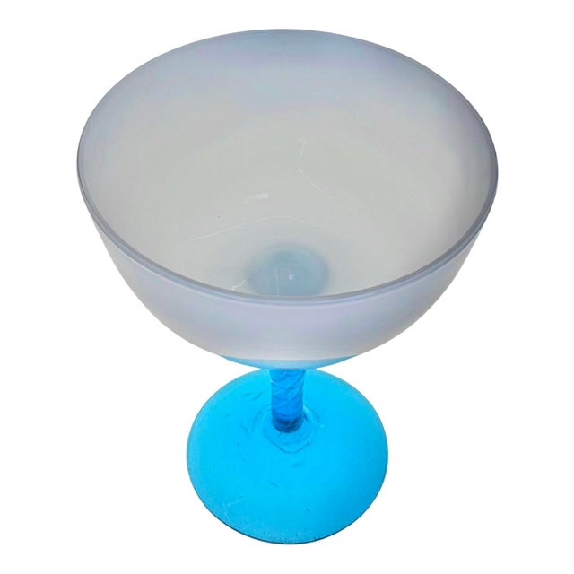 A striking example of Italian modern glass design, this Empoli-style compote pairs an opaline glass bowl with a vibrant...