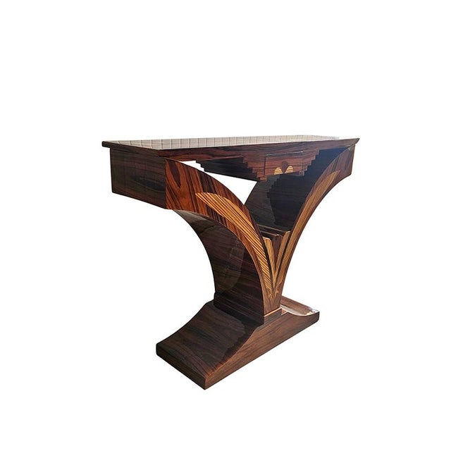Art Deco console table from the 1940s, in walnut burl with geometric birch inlays, curved base with a small central...