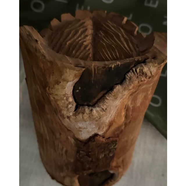 Hand-carved in the 1930s, this rustic folk art sculpture features a deeply expressive face rendered in solid wood. The...