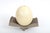 Signed ceramic sculpture by American artist Diane Solomon Kempler, pairing a natural ostrich egg with a hand-built...