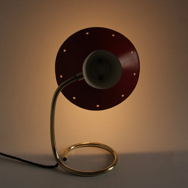 This lamp is from France and was made in the 1950s. It consists of brass and two original lacquered aluminum shades in the...