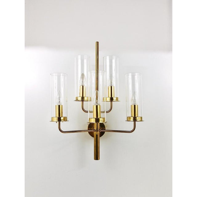 A beautiful and elegant, large modernist candelabra brass wall light / sconce from the 1960s, model sonata v-169/5,...