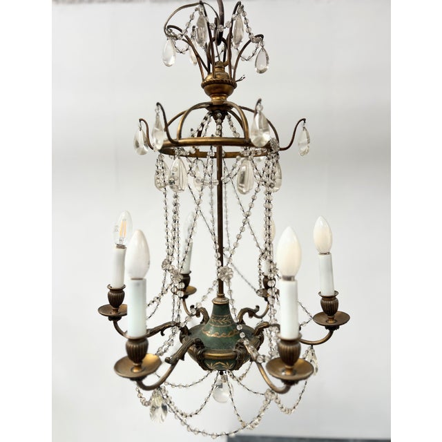 Louis XVI style chandelier with beaded garlands Bronze and painted sheet metal frame Six-light chandelier Good condition...