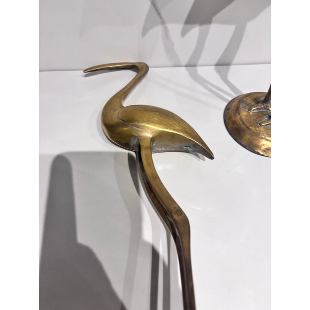 A Pair of Vintage Solid Brass Crane Figurines Standing Gracefully on Round Bases With a Warm, Aged Patina. For Sale - Image 9 of 12