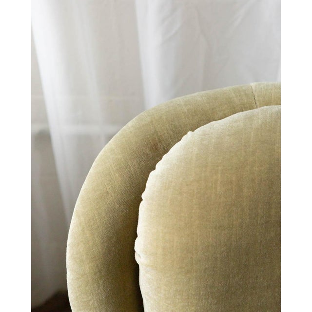 A handsome pair of Danish lounge chairs from the 1970s, upholstered in rich velour with fringe trim — a combination that...