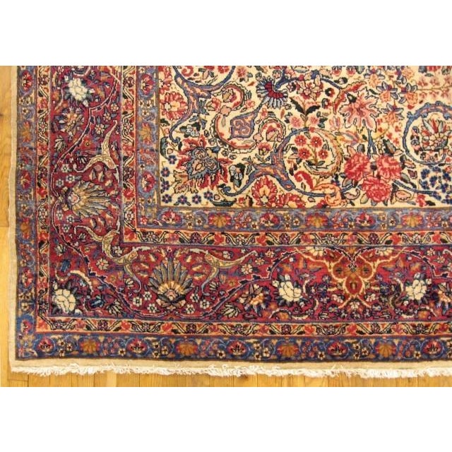 a 1920s Floral Persian Kerman Room-size Rug in excellent condition