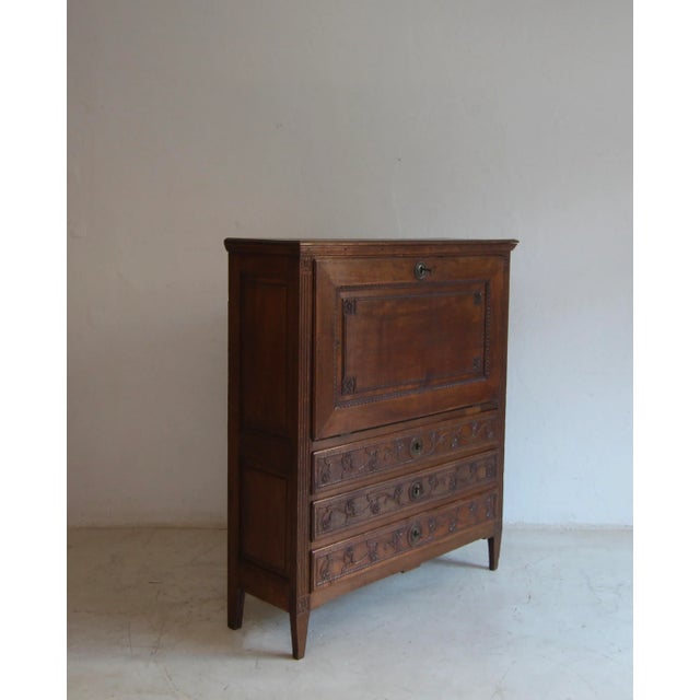 A provincial louis xvi secretary or ‘secrétaire à abattant’. Classicism, late 18th century. Made from solid oak. straight-...