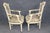 This elegant pair of French Louis XVI-style fauteuils, dating to the early twentieth century, circa 1900–1920, displays...